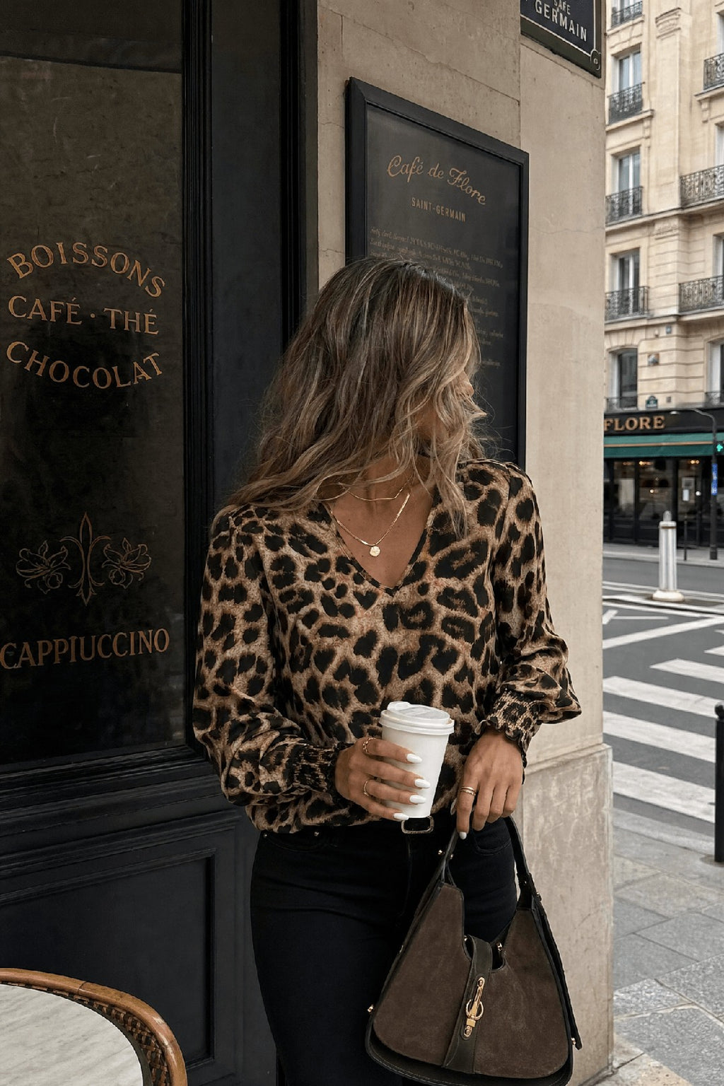 Nice leopard V-neck blouse in ginger-toned classic leopard, golden hour editorial — Amavé.