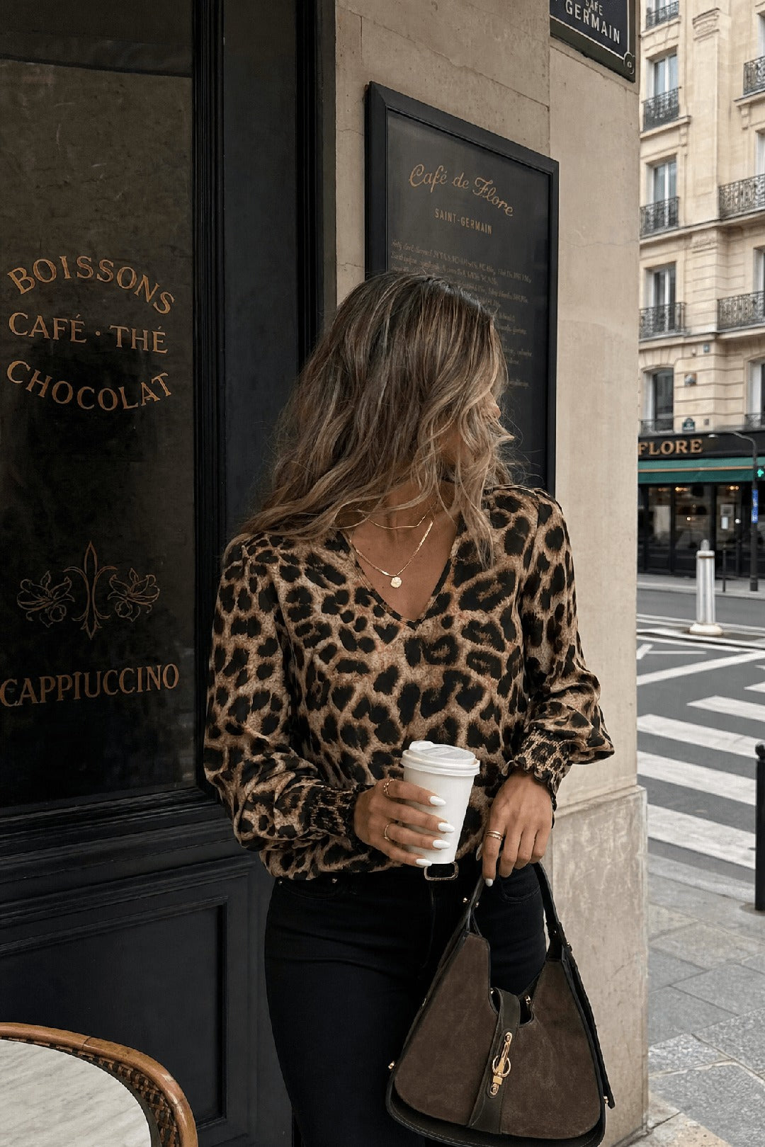 Nice leopard V-neck blouse in ginger-toned classic leopard, golden hour editorial — Amavé.