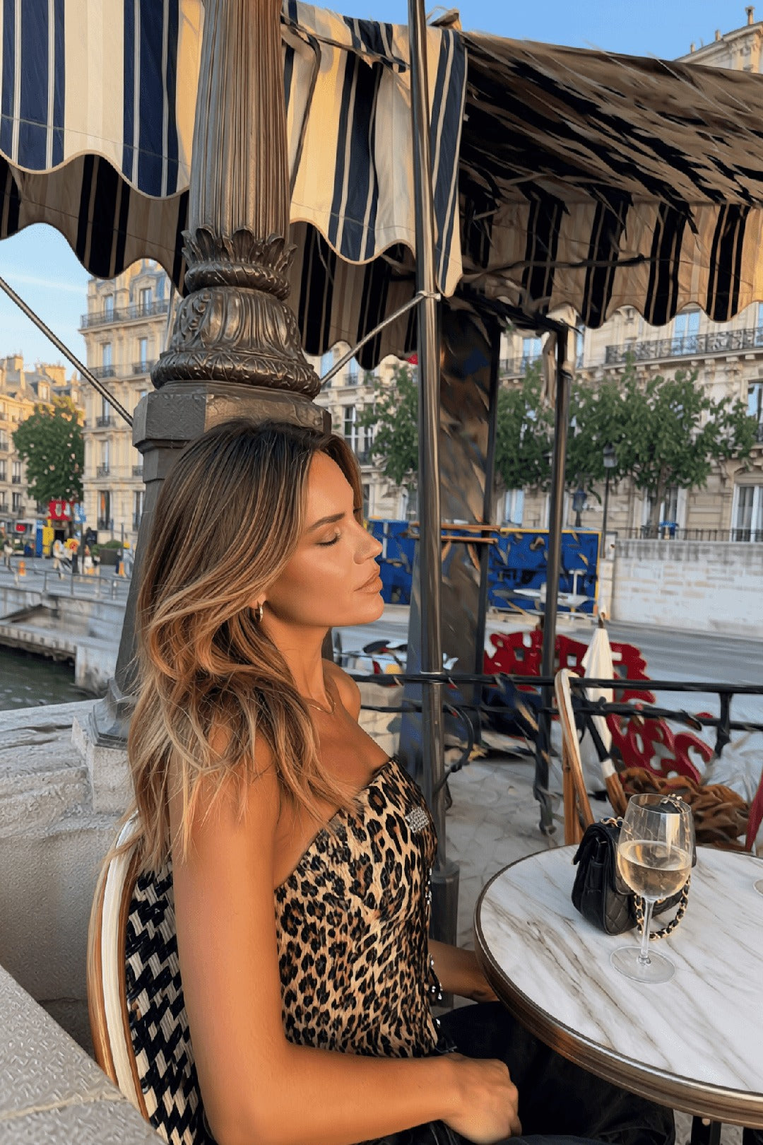 Sienna leopard sequin bandeau, three-quarter editorial pose, after-dark Amavé.